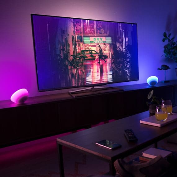 Philips Hue Go Portable Table Lamp on a desk